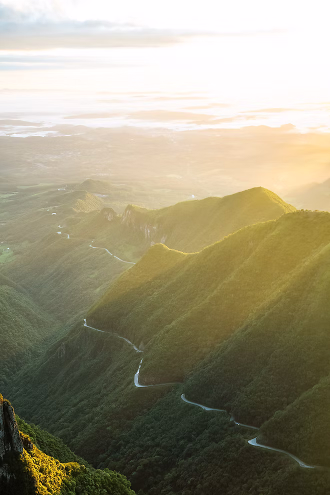 Winding road through lush green mountains.
